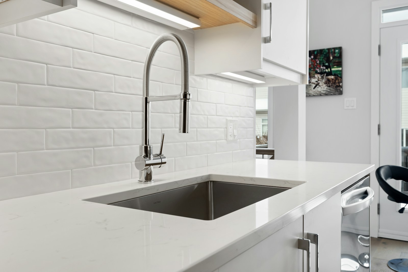 A kitchen with fitted cabinetry and worktops; household daytime-use context.